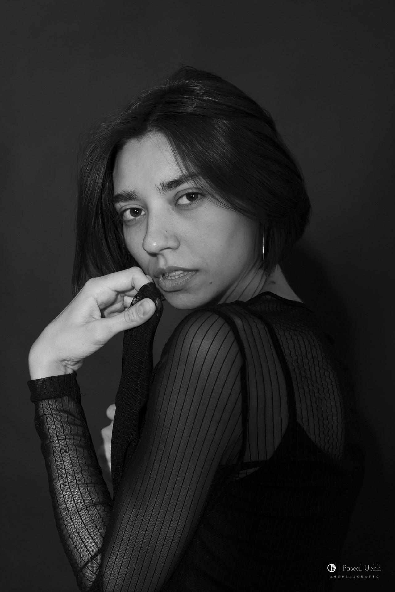 Irina Lozovaya in a black and white studio portrait by Pascal Uehli
