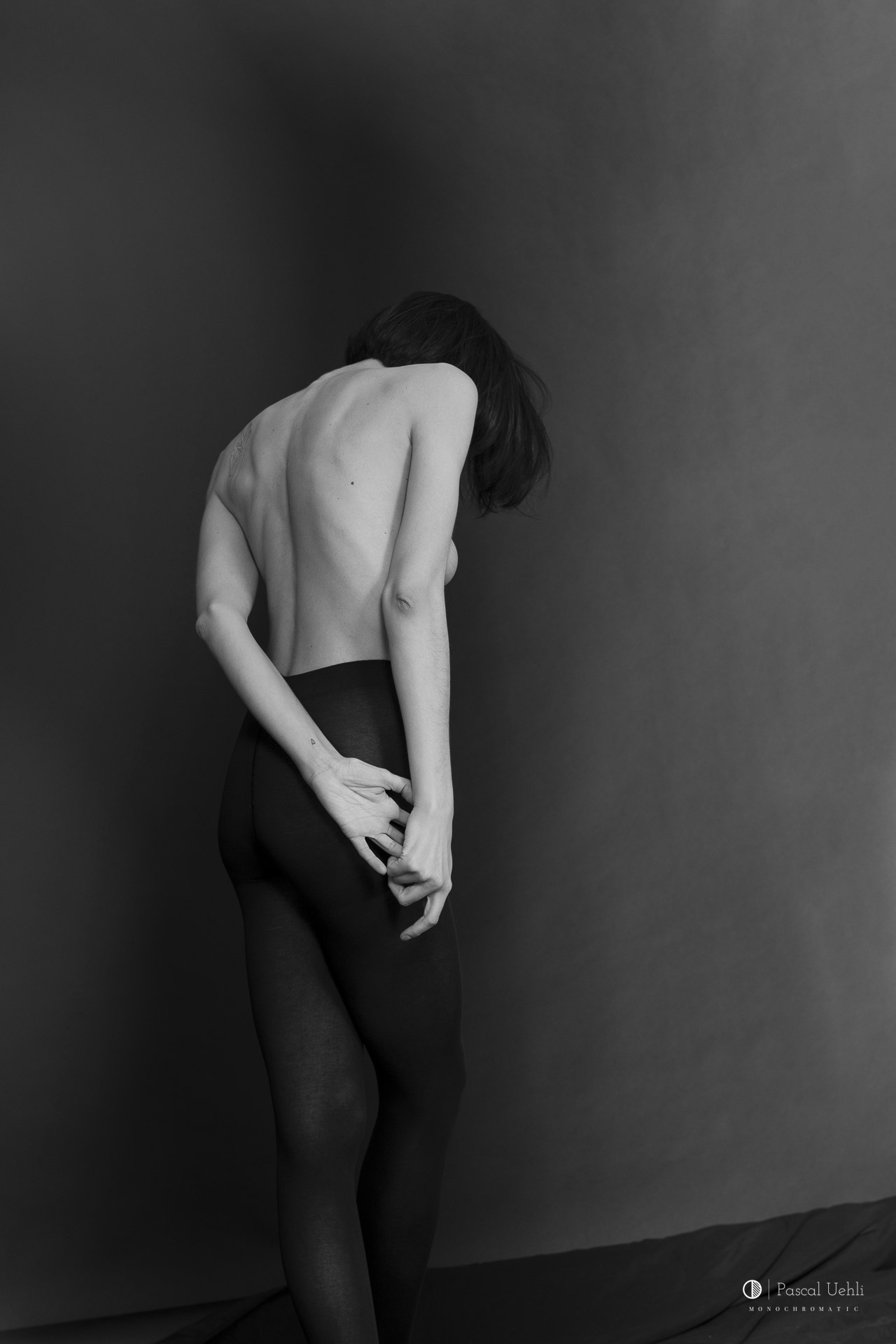 Irina Lozovaya in a black and white studio portrait by Pascal Uehli