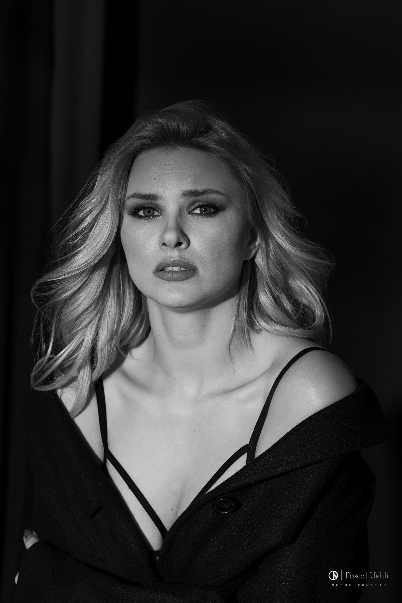 Carla in a black and white studio portrait by Pascal Uehli