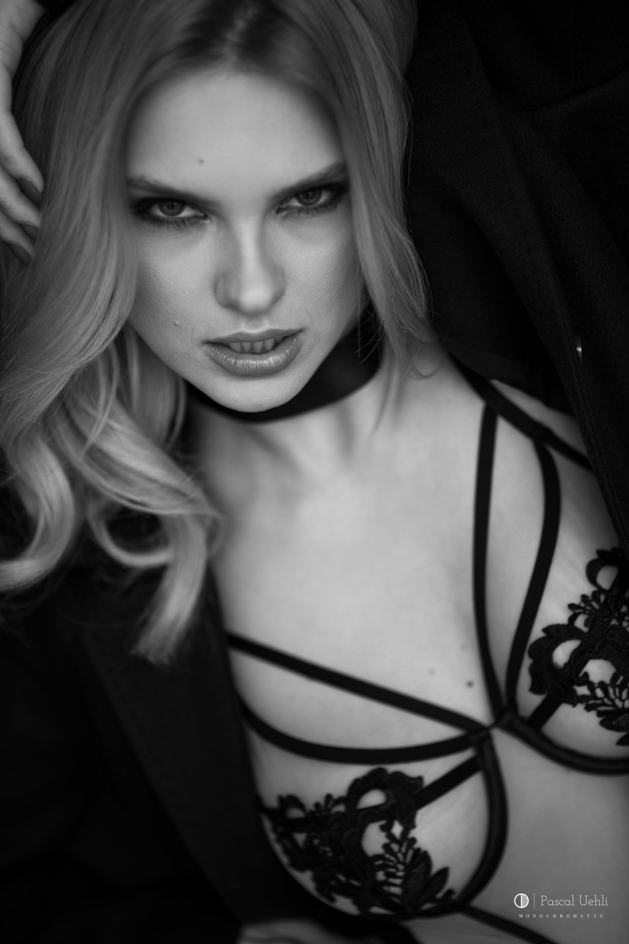 Carla in a black and white studio portrait by Pascal Uehli